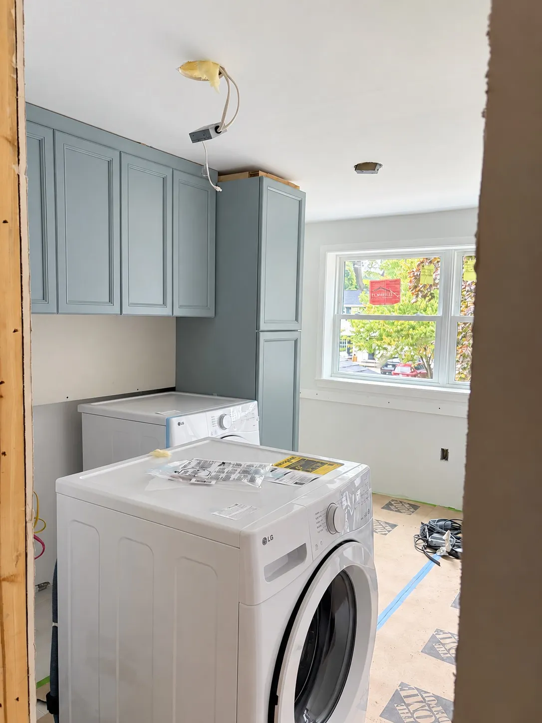 The upstairs laundry room, with cabinetry installed